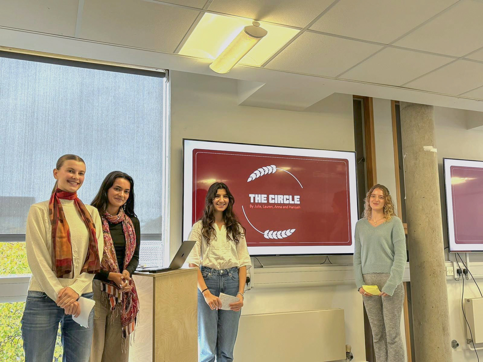 Anna, Lauren, Julia and I presenting our pitch decks